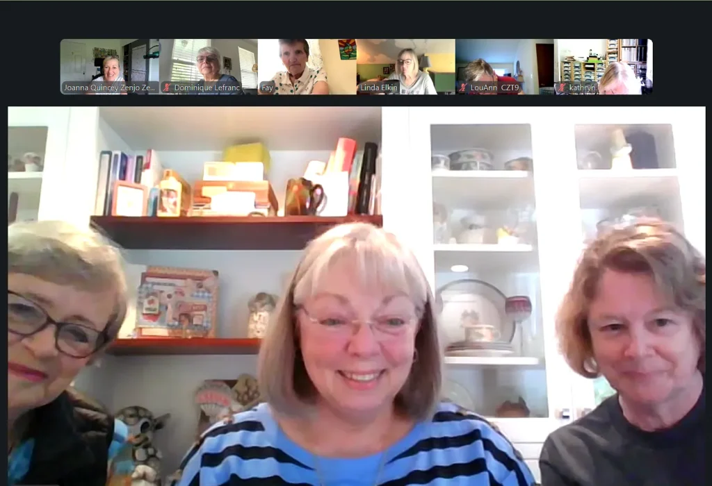 A video call screen showing smiling members of the Zenjo Tangle Club, highlighting the close-knit community and worldwide friendships.